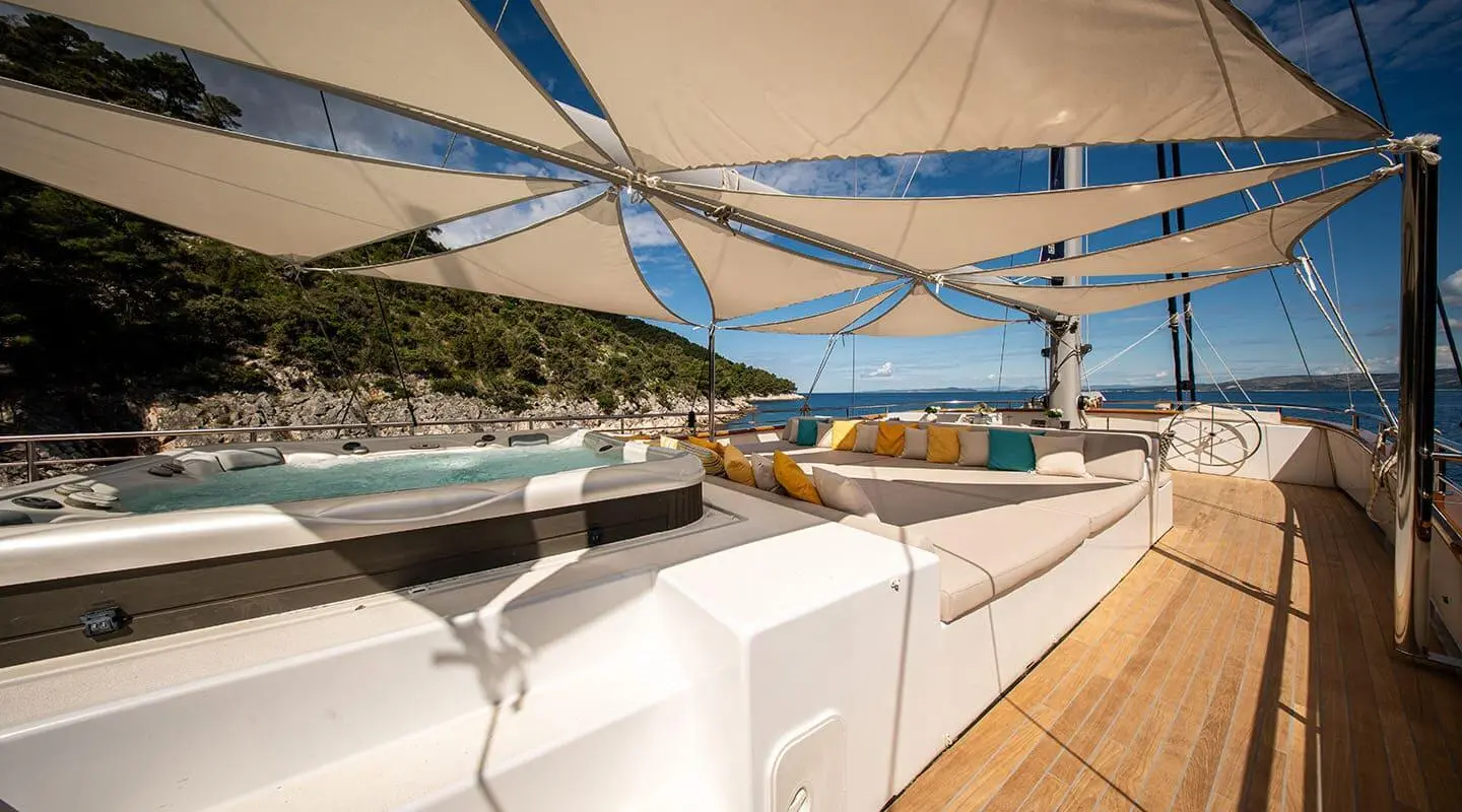 Dalmatino yacht deck at sunset with rope nets and seating area