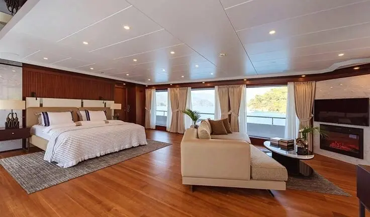 Ocean Breeze master cabin with king bed and ensuite, wooden floor, neutral decor