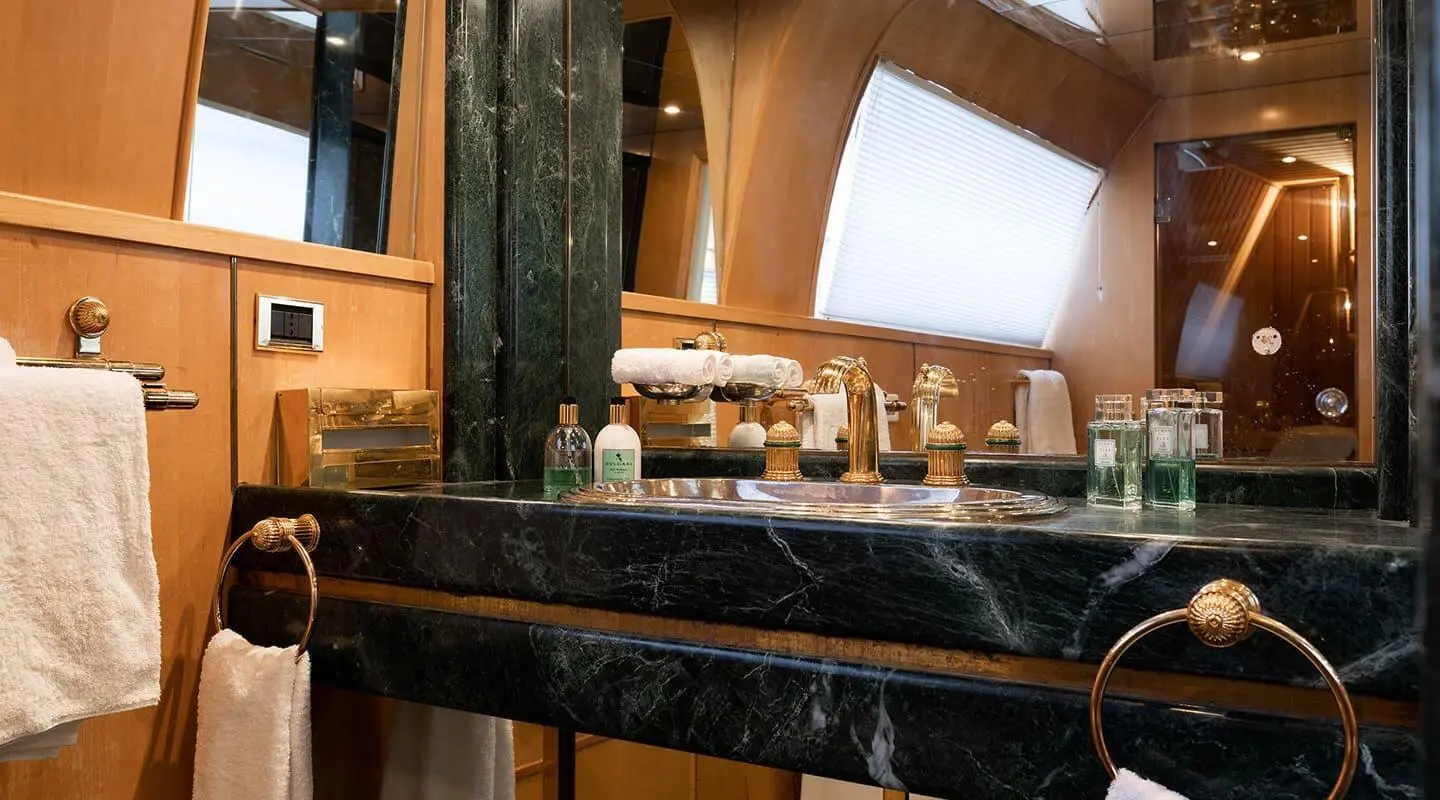 Luxurious yacht Brooklyn bathroom with marble-topped counter and vanity