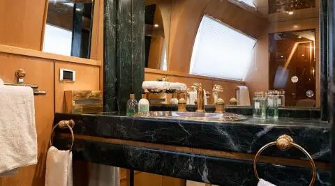 Luxurious yacht Brooklyn bathroom with marble-topped counter and vanity