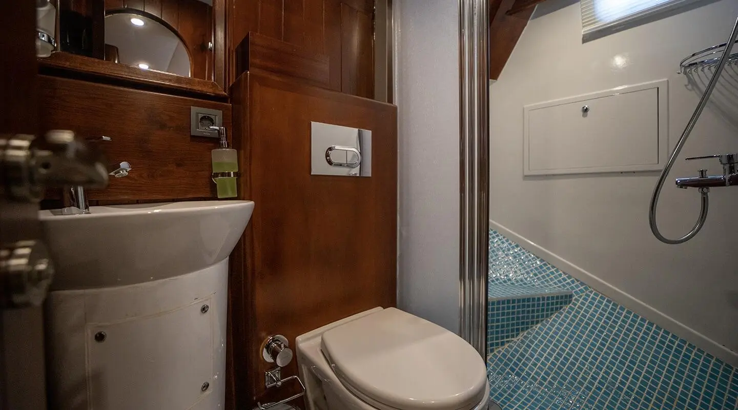 Luxurious yacht Ulucinar interior with wooden walls, doorway, and pool visible
