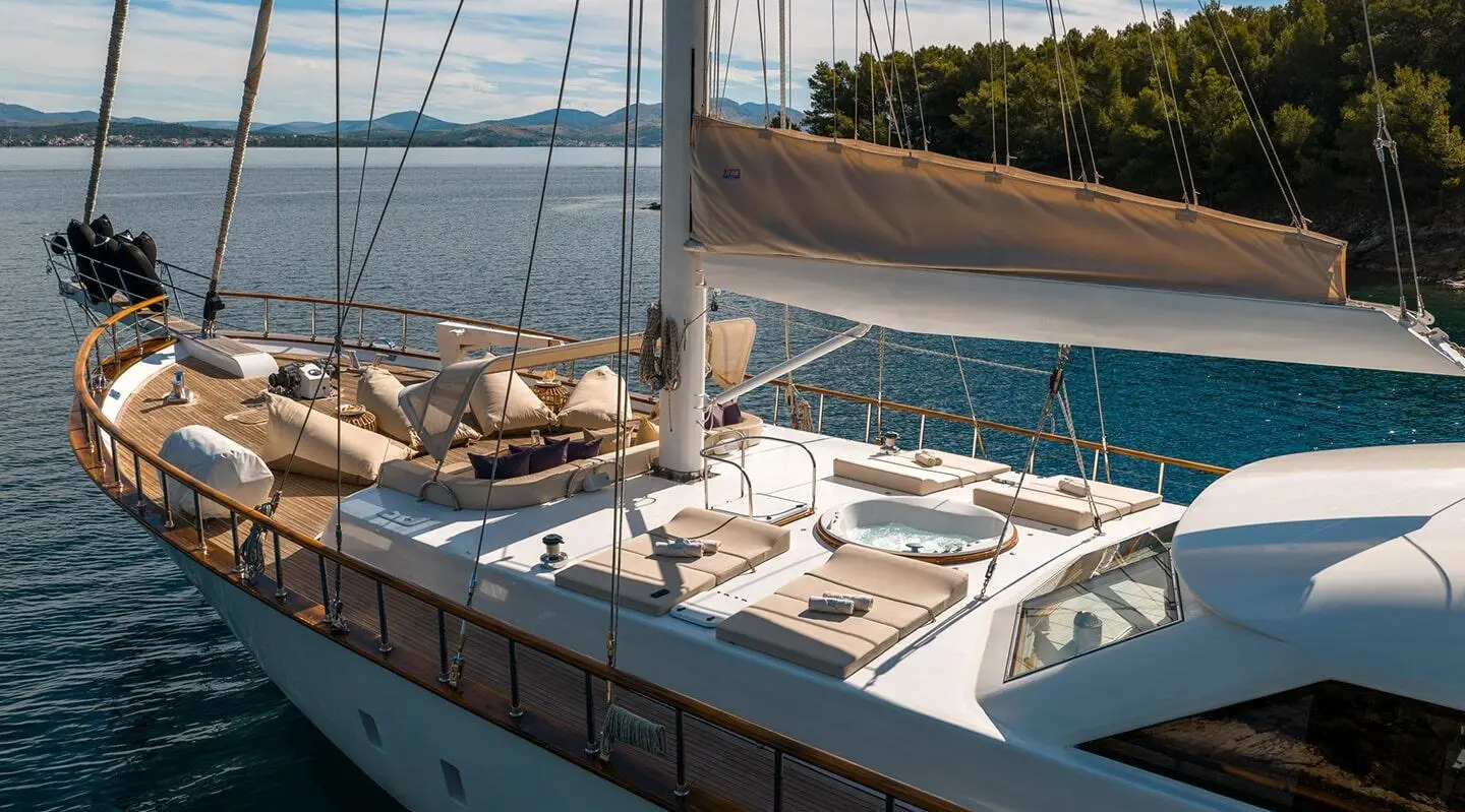 Alessandro I yacht deck view at sunset with railing and calm sea