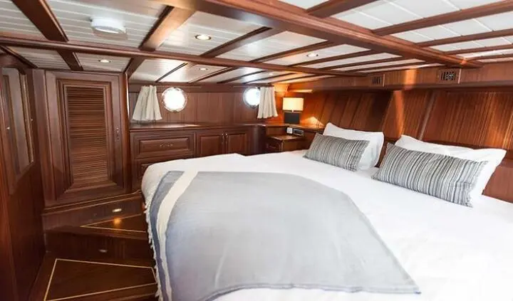 Primadonna yacht master cabin with king bed, wood paneling, ensuite hints