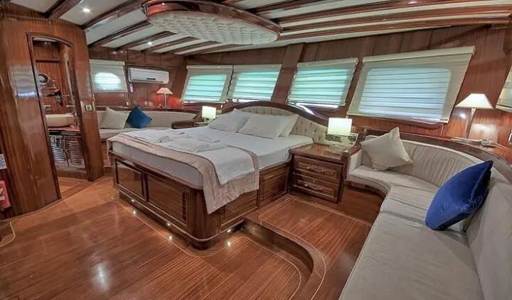 Lycian Queen master cabin with king bed and ensuite bathroom on yacht