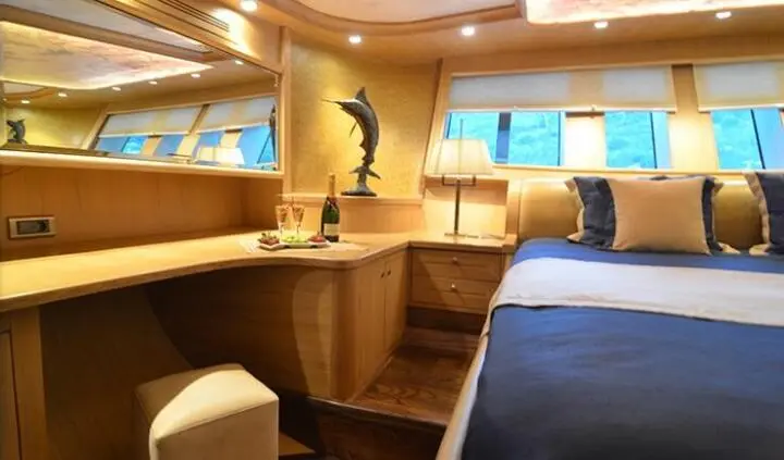 Blue Heaven yacht master cabin with king bed and ensuite, wood finish, soft lighting
