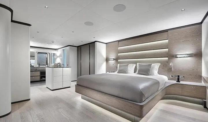 Master cabin with king bed, ensuite, neutral tones, wood accents, built-in storage