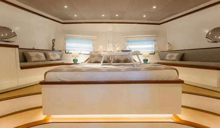 Grand Sailor yacht master cabin with king bed, ensuite, warm lighting, large window
