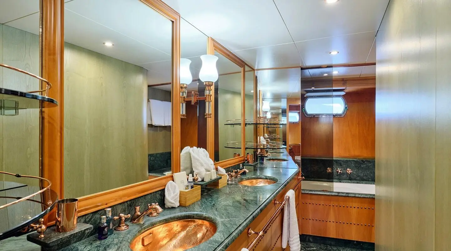 Luxurious Mobius yacht interior with polished wooden bar and seating area