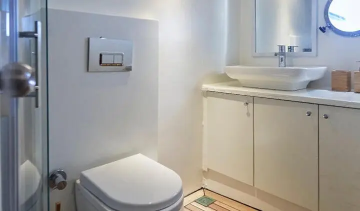 Derya Deniz master cabin ensuite bath with toilet and vanity, compact space