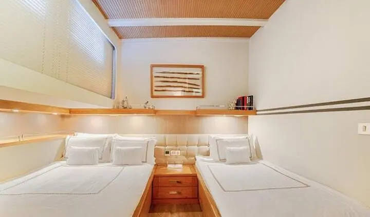 Cobra King yacht cabin interior with twin beds and ensuite area