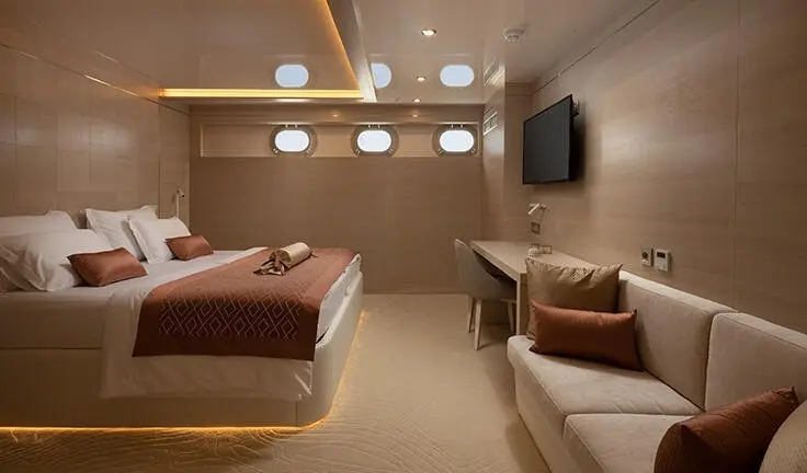 Love Story yacht cabin with king bed, ensuite, ambient lighting and seating