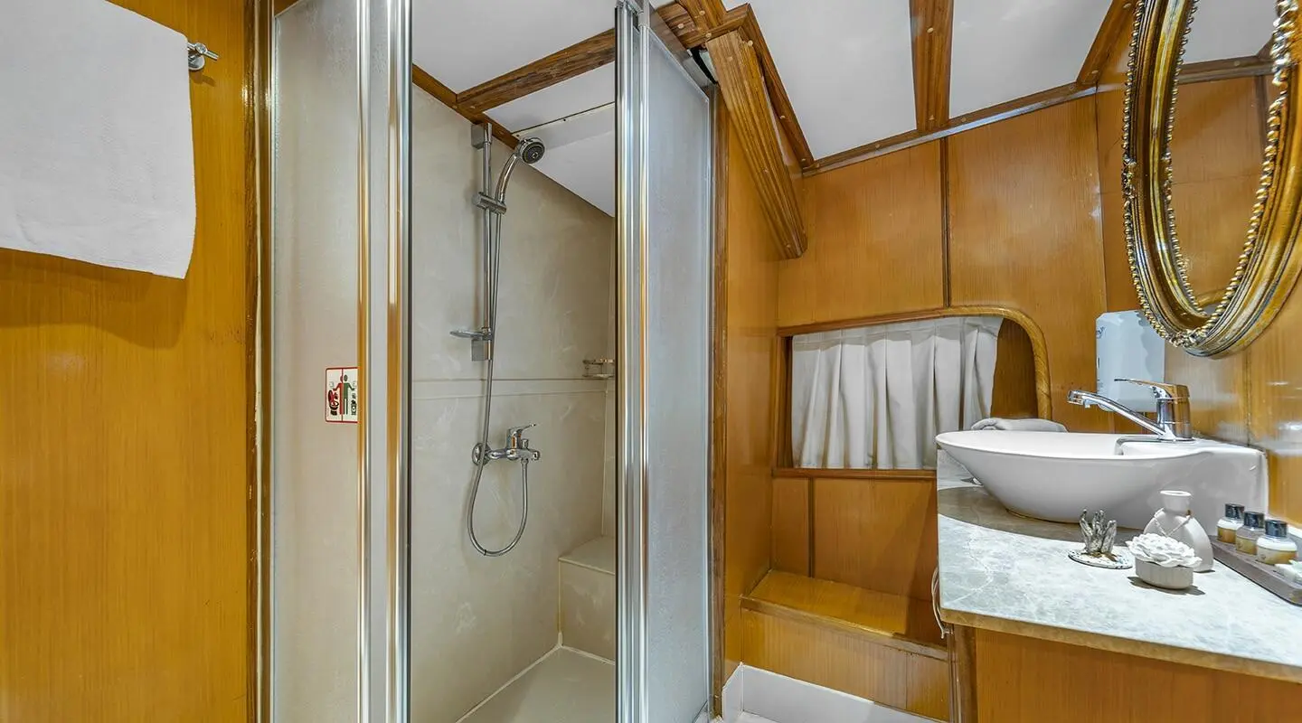 Tersane 8 luxury gulet bathroom interior: wooden walls, shower enclosure, towel hooks