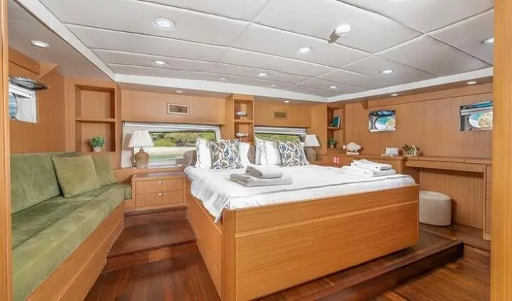 Artemis yacht master cabin with king bed, ensuite, wood accents, neutral tones