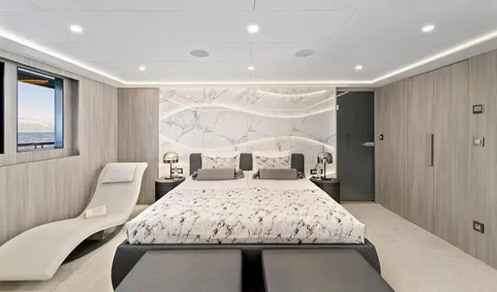 Master cabin with king bed, ensuite, soft lighting, neutral decor