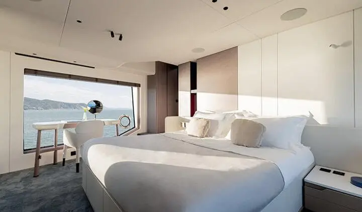 Master cabin with king bed and ensuite, large windows and soft lighting