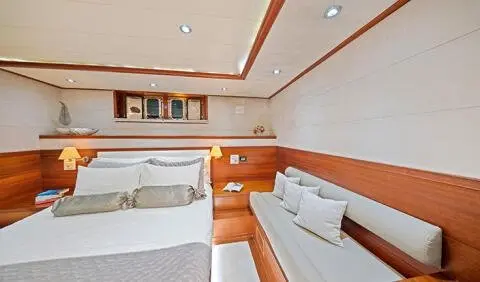 Master cabin with two single beds and ensuite area, wood accents