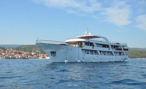 Melody motor yacht, 42.10 m, white hull on calm blue sea