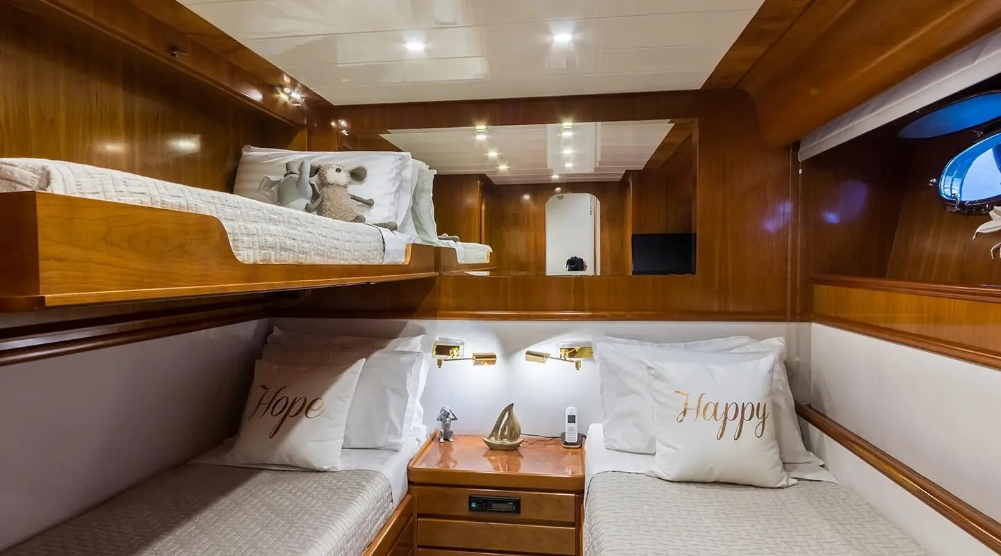 Interior of Amoraki yacht lounge with white seating and wooden accents