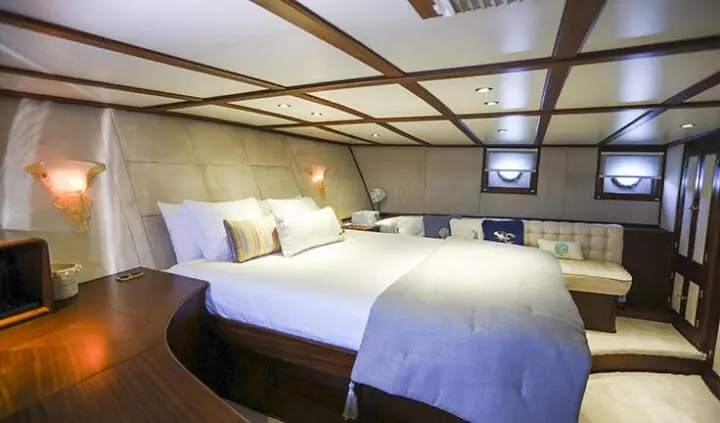 Gazella master cabin with two large beds and ensuite in blue-gray decor