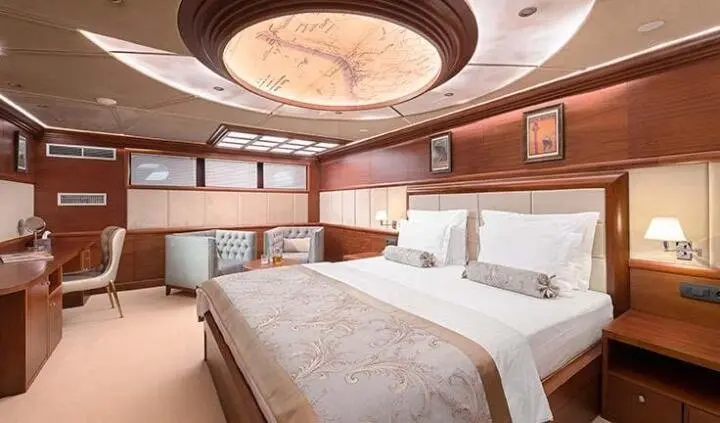 Master cabin aboard Lady Gita with king bed and ensuite fixtures visible