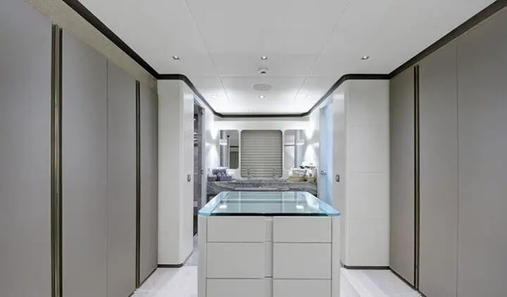 Master cabin with king bed and ensuite, view from doorway on yacht