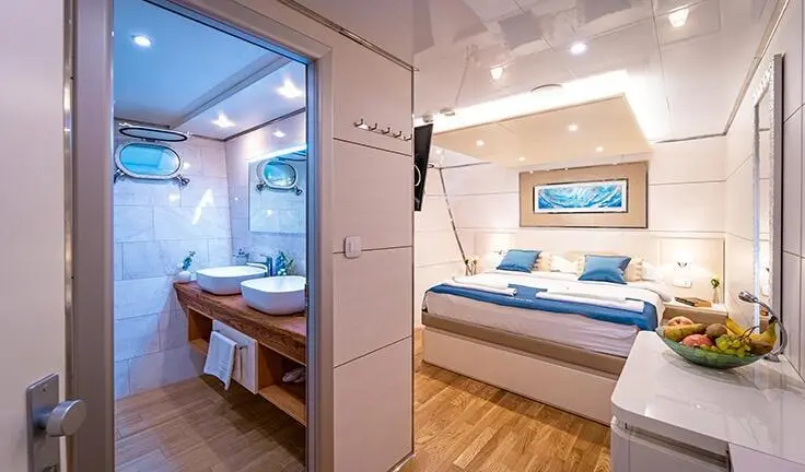 View of a yacht master cabin with a king bed and ensuite visible