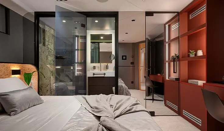Master cabin with king bed and ensuite visible on yacht Anetta