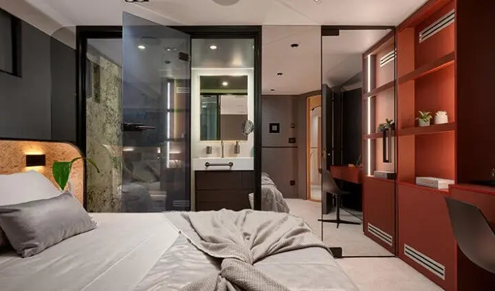 Master cabin with king bed and ensuite visible on yacht Anetta