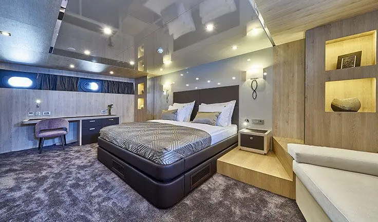 Master cabin with king bed, ensuite, ambient lighting, neutral tones