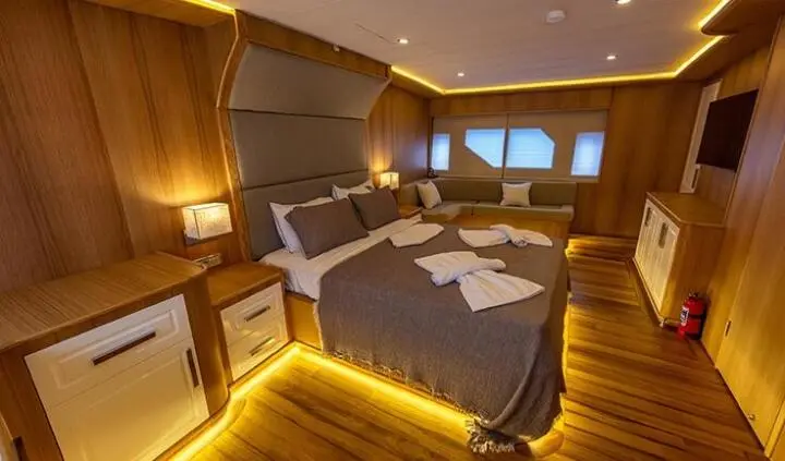 Double cabin with king bed on Simay M yacht, warm ambient lighting