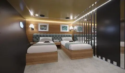 Santa Clara yacht cabin with two single beds, wooden headboards, and ensuite bathroom visible