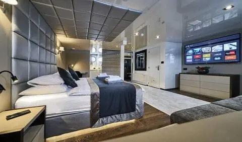 Master cabin with king bed, ensuite, navy bedding and luxury decor