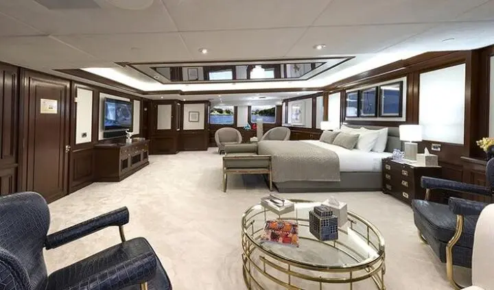 Master cabin with king bed and ensuite on Chakra yacht interior