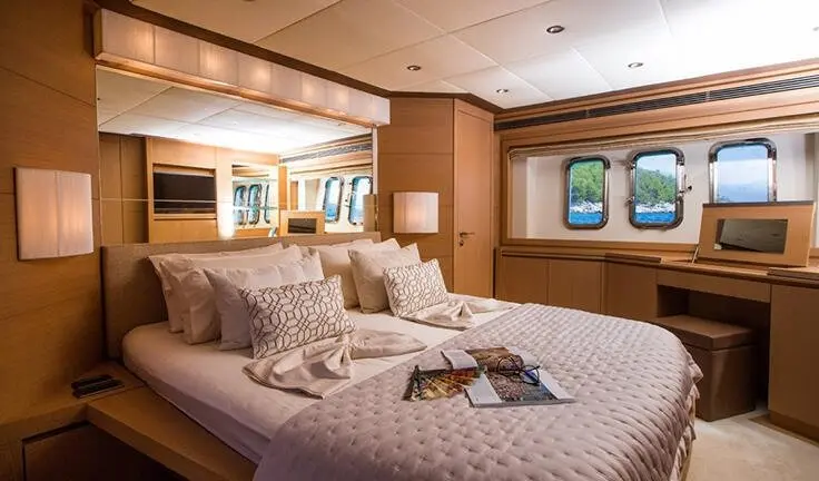 Master cabin on Salt yacht with king bed, ensuite and soft lighting