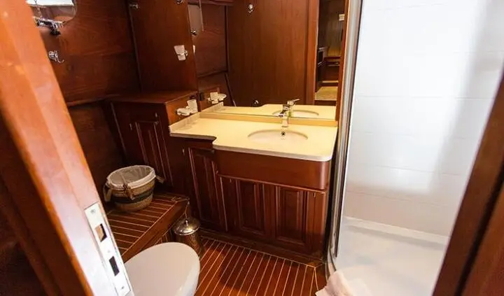 Dolce Vita master cabin with king bed, wooden cabinetry and ensuite