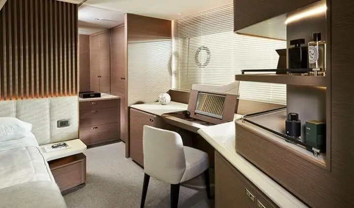 Queen bed cabin with ensuite on Elizabeth yacht, wood paneling and neutral tones