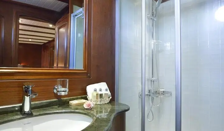 Master cabin with king bed and ensuite view aboard Lady Christa yacht