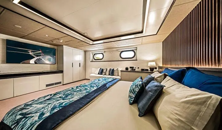 Anima Maris master cabin with king bed and ensuite, teak accents