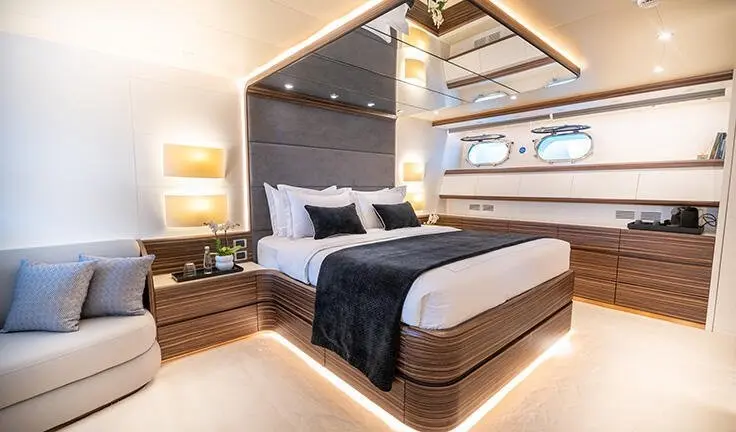 Pareaki II master cabin with king bed, ensuite visible in yacht interior