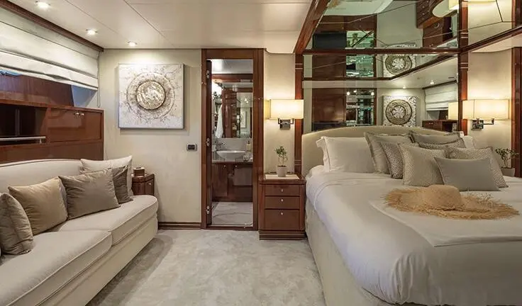 Grace yacht cabin with king bed, ensuite, wooden cabinetry and neutral decor