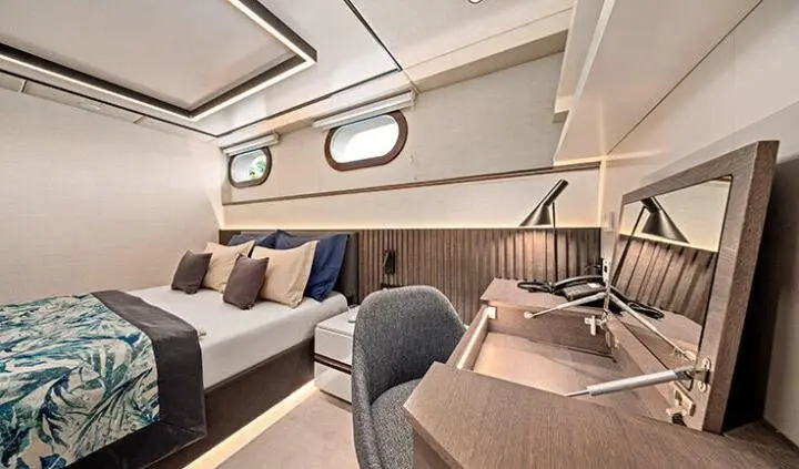 Anima Maris master cabin with king bed, ensuite, desk, and seating