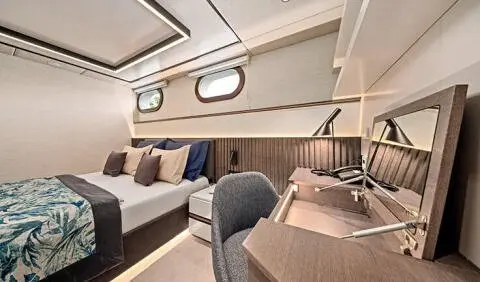 Anima Maris master cabin with king bed, ensuite, desk, and seating