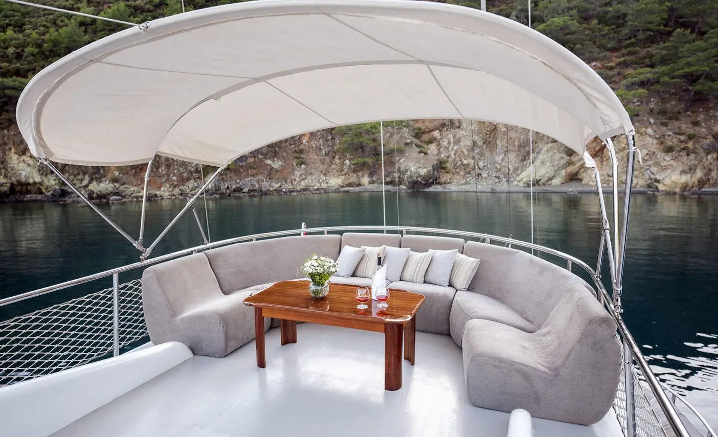 Kayhan 4 yacht on a charter with a shaded deck lounge and seating area