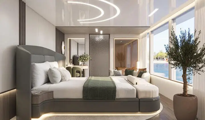 Spacious yacht cabin with large bed, pillows, and modern decor
