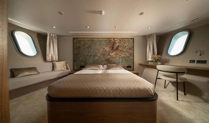 Master cabin with king bed, ensuite, dim ambient lighting and decor