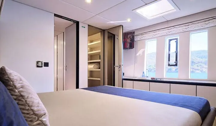 Master cabin with king bed, ensuite, window view and built-in storage