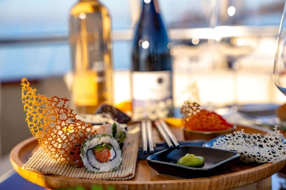 Double Eagle yacht charter: view of a table with bottled drinks and snacks near water