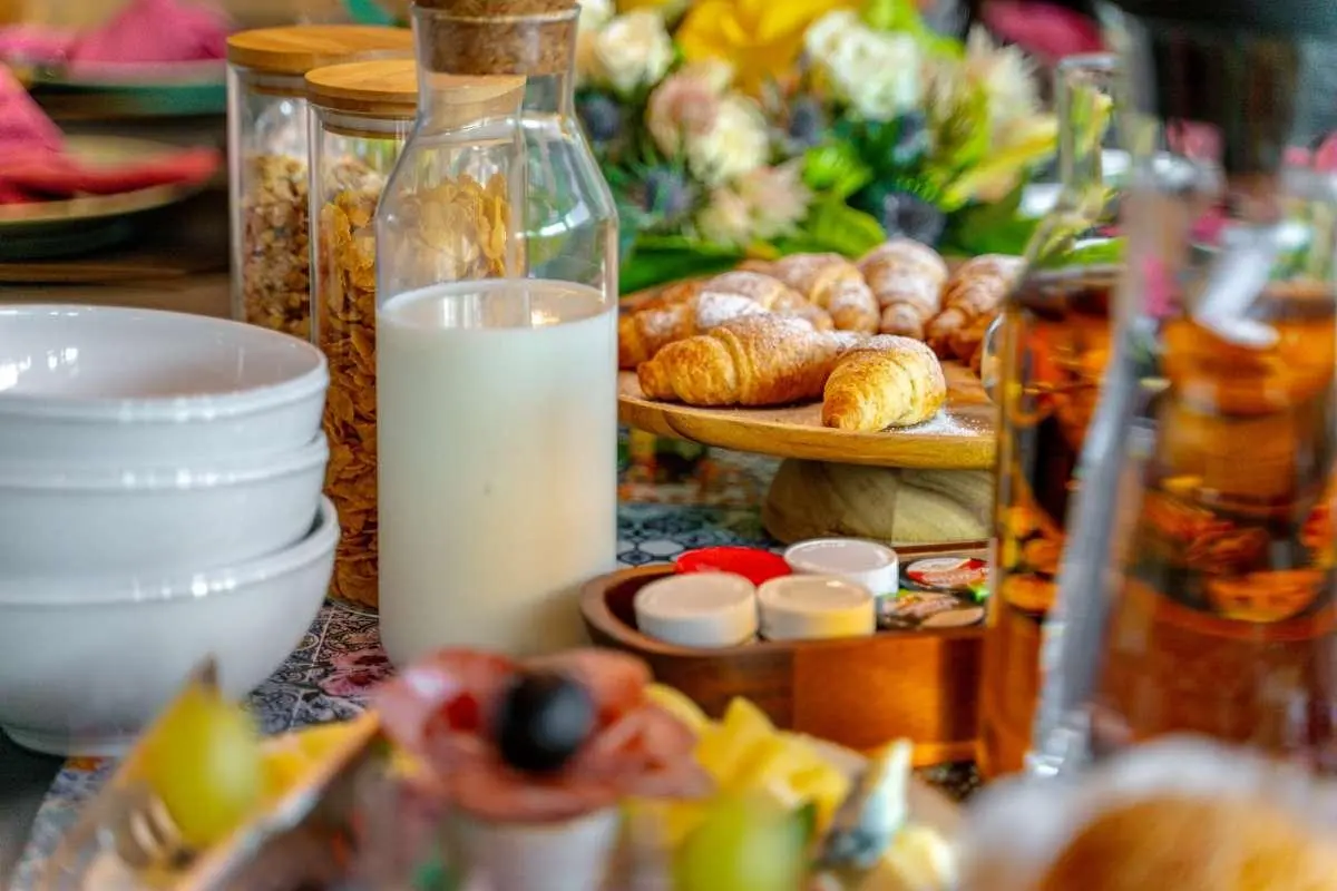 Yacht Freedom dining scene with fruit, pastries, and beverages on table