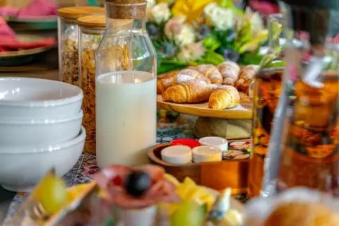 Yacht Freedom dining scene with fruit, pastries, and beverages on table