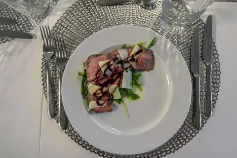 Crystalline yacht Cristal dinner plate with salad on table setting